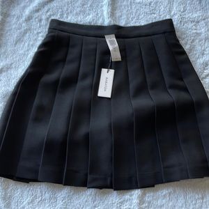 Aritzia Babaton Black pleated skirt, size 6.